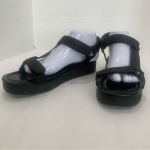 UNISA brand new size 11 black strappy sandals with velcro closures. Easy adjust